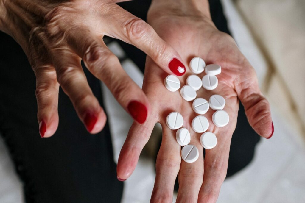 A pile of abortion pills in a woman's hand