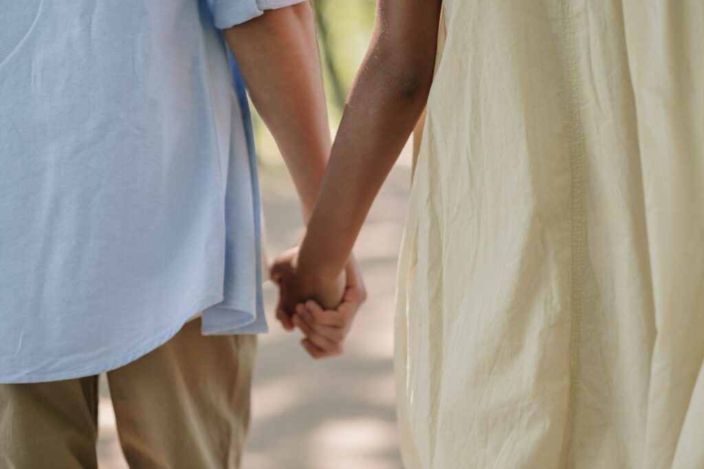 Couple holding hands lovingly talking about STI testing